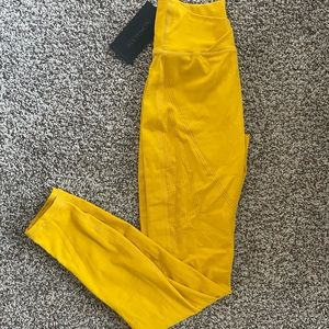 Alphalete surface path laser cut leggings